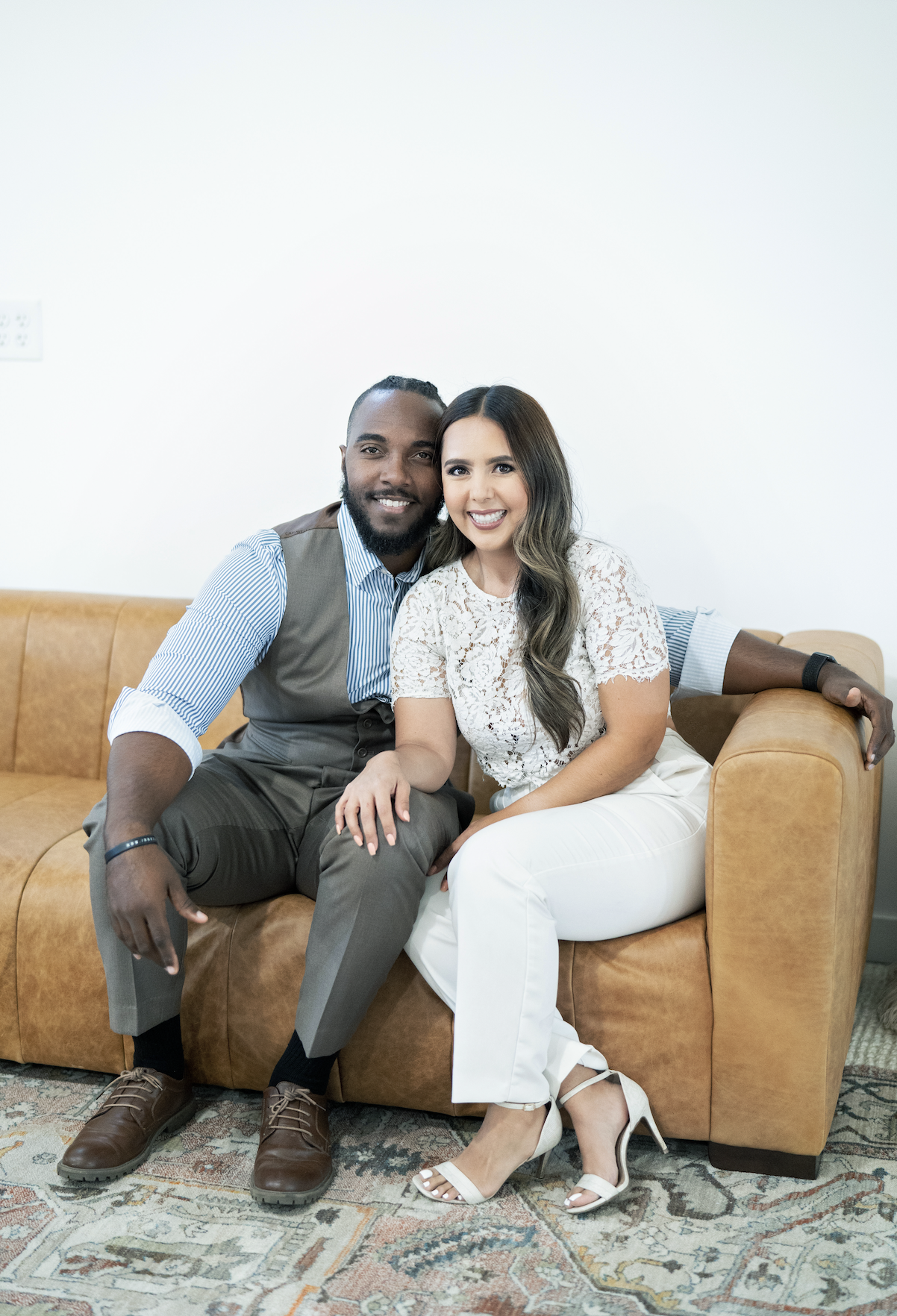 Relationship coaches sitting on couch during session